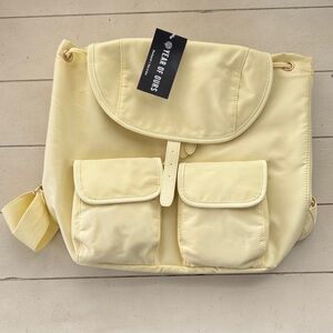 Year of Ours Pale Yellow Nylon Drawstring Backpack with Front Pockets